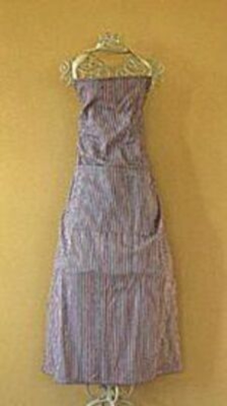 100% Cotton apron with blue and red stripes. Pocket on front. Size 72X100cm